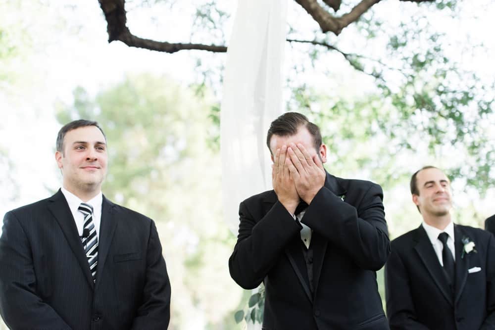 groom crying during outdoor ceremony