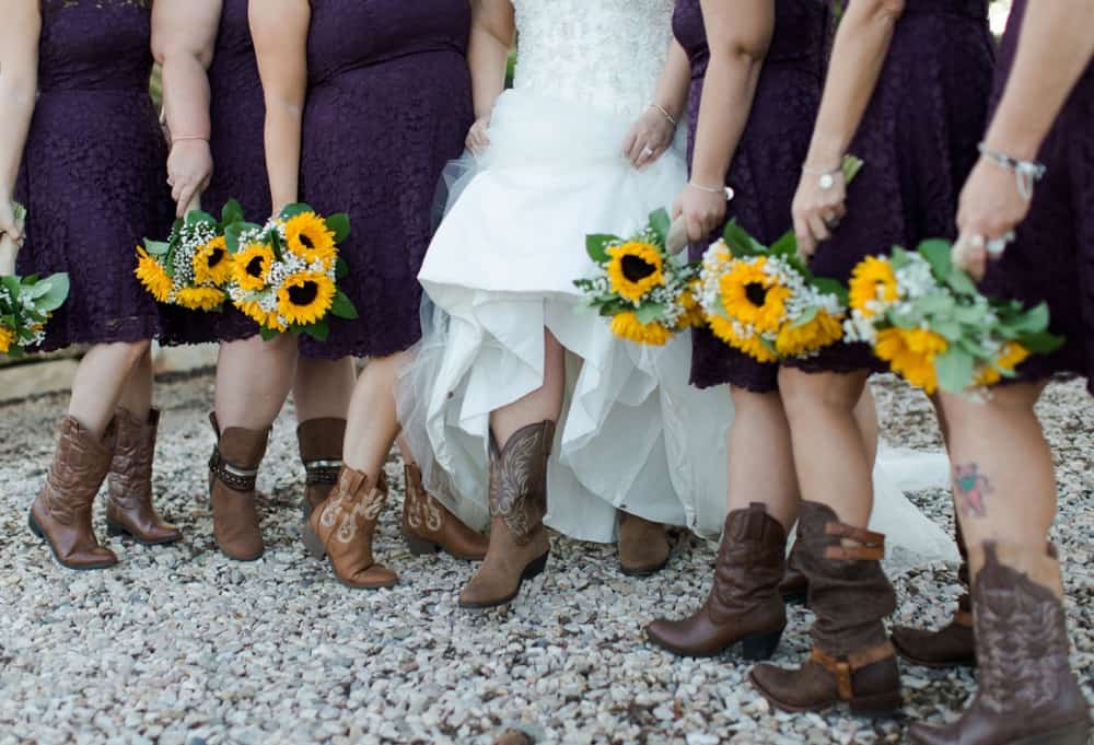 bridesmaids wearing cowboy boots at wedding