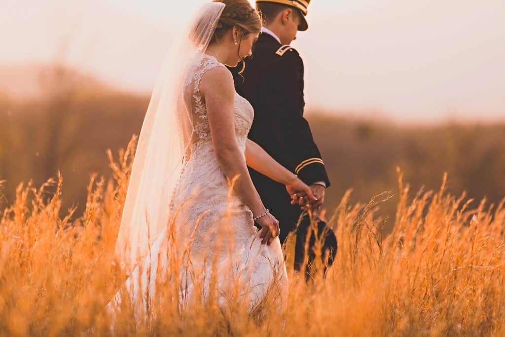 newlyweds walking during sunset photos at sierra vista
