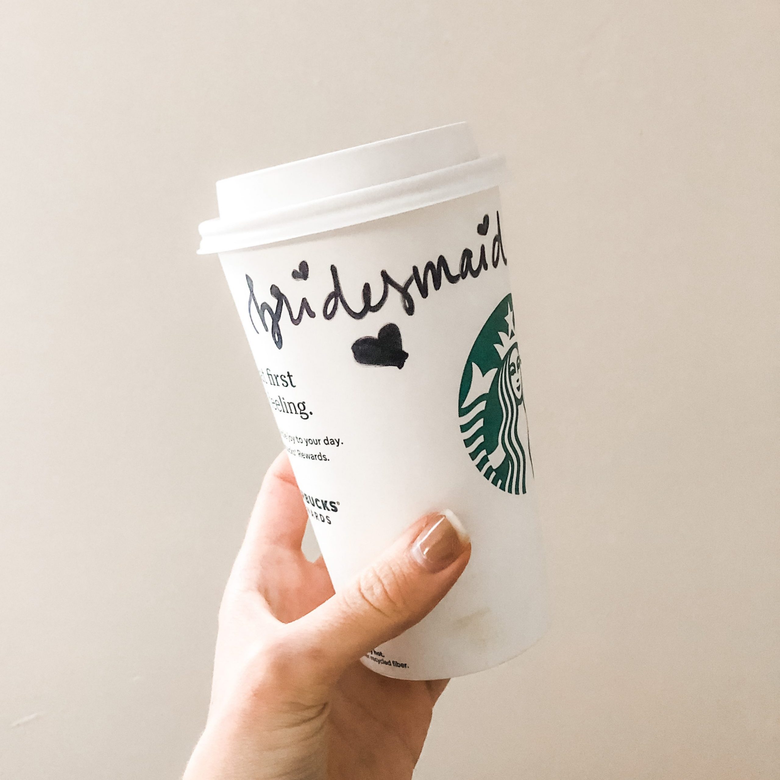 Bridesmaid proposal written on Starbucks coffee cup