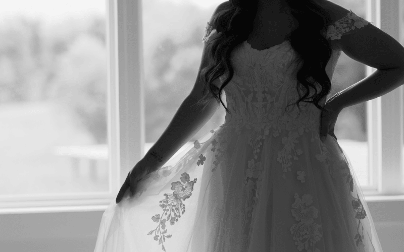 A bride shopping for a wedding dress at Ashley Grace Bridal