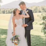 A perfect couple at a vineyard wedding wearing a wedding dress from Ashley Grace Bridal