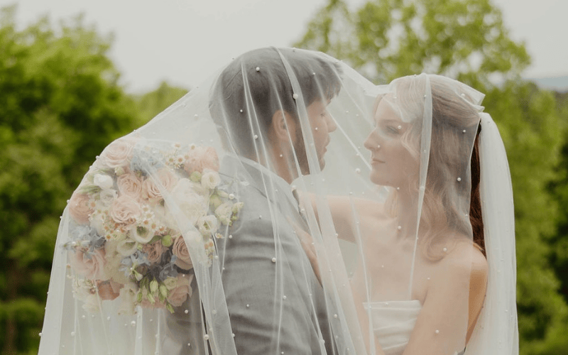 Bridal Accessories: Bride and Groom with a veil