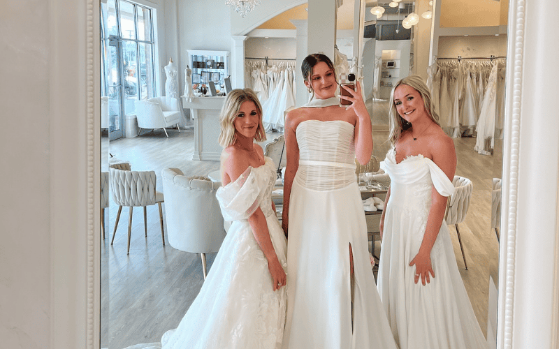 three brides doing a mirror selfie