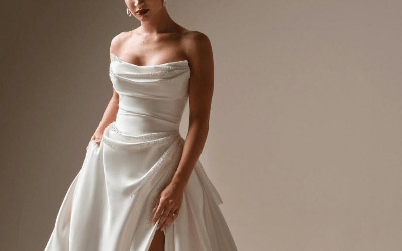 bride wearing a soft glam satin gown with beaded details