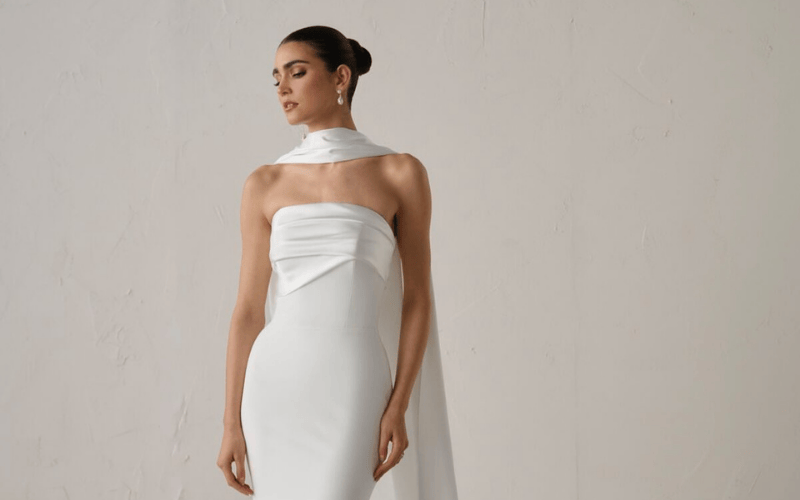 bride wearing a minimal gown and a bridal scarf