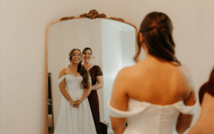 bridal appointment tips, bride with mom in front of the mirror