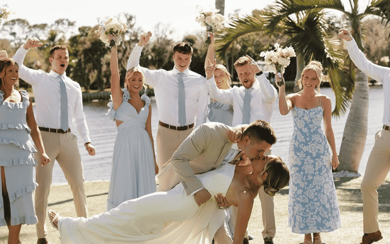 bride and groom with bridesmaid