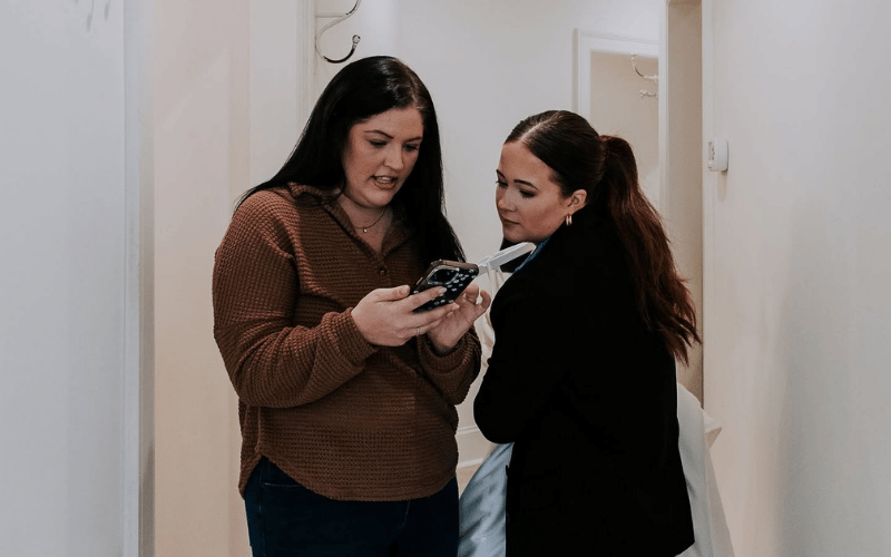 bride looking at inspiration on the phone